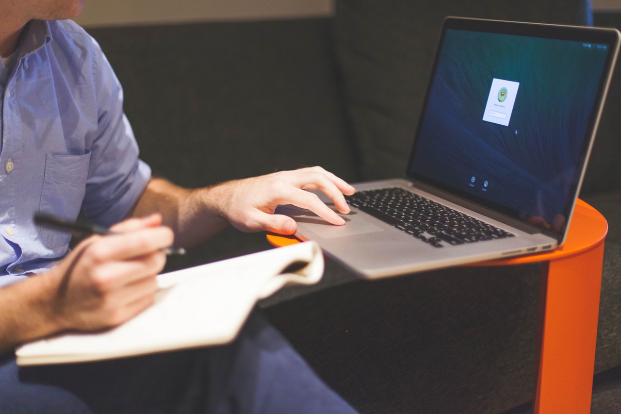 Man notebook notes macbook